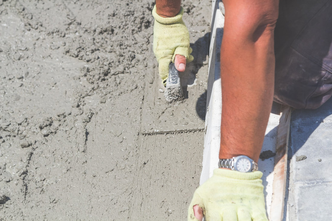 An image of a person working on a concrete company